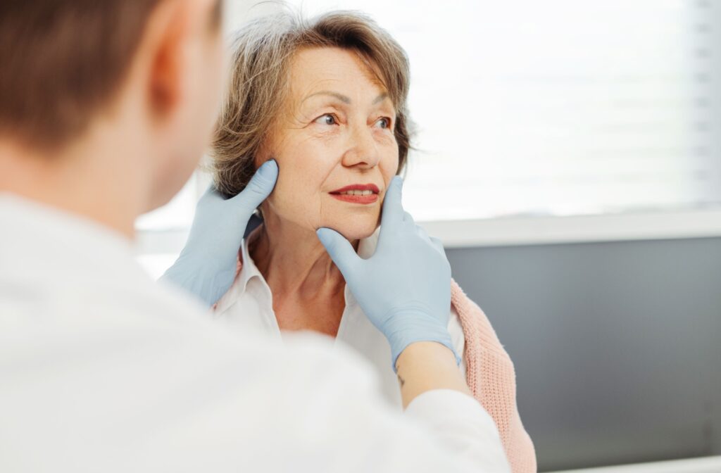 Practitioner looking at patients face prior to cosmetic injectables
